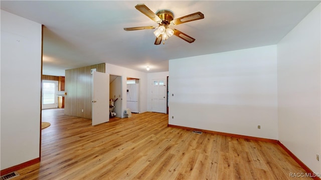 unfurnished room with ceiling fan and light hardwood / wood-style flooring