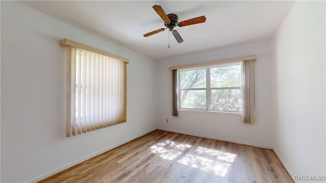 unfurnished room featuring light hardwood / wood-style floors and ceiling fan