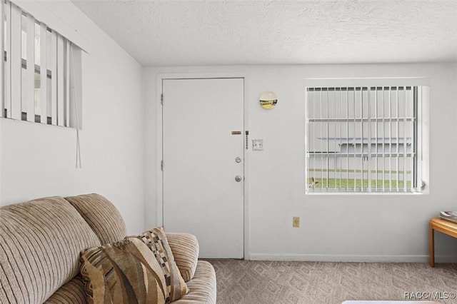 2 James St, Beverly Hills, FL 34465 - foyer featuring carpet and a textured ceiling
