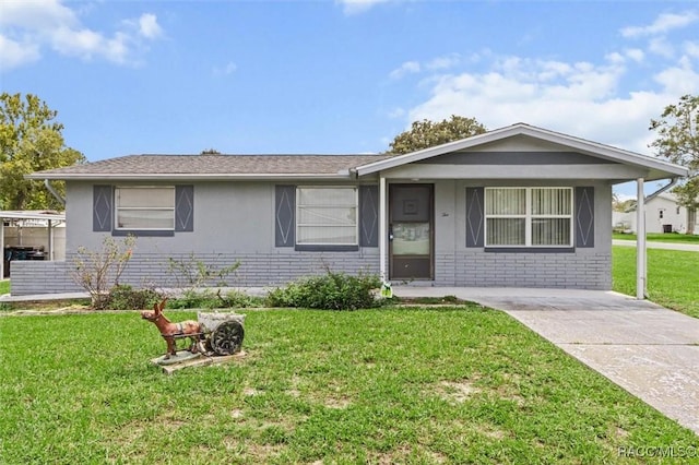 2 James St, Beverly Hills, FL 34465 - single story home featuring brick siding, a front yard, and stucco siding