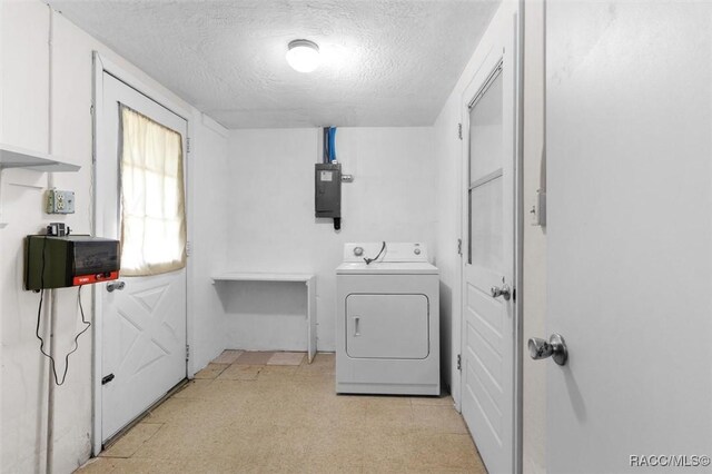 2 James St, Beverly Hills, FL 34465 - washroom with washer / dryer, a textured ceiling, electric panel, and light floors