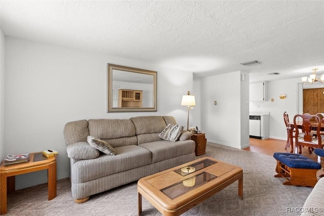2 James St, Beverly Hills, FL 34465 - carpeted living area featuring a chandelier and a textured ceiling