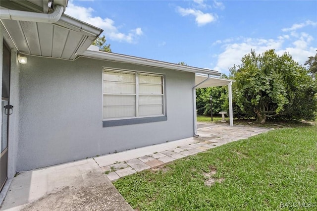 2 James St, Beverly Hills, FL 34465 - view of green lawn with a patio area