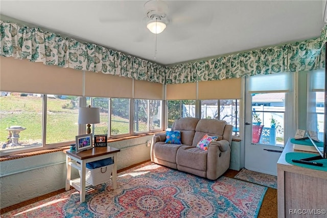 living area featuring ceiling fan