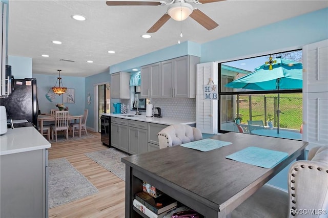 dining area featuring visible vents, light wood finished floors, a ceiling fan, and recessed lighting