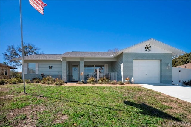 ranch-style house with an attached garage, a front yard, a porch, and brick siding