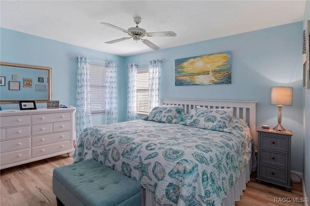 bedroom featuring light wood finished floors and ceiling fan