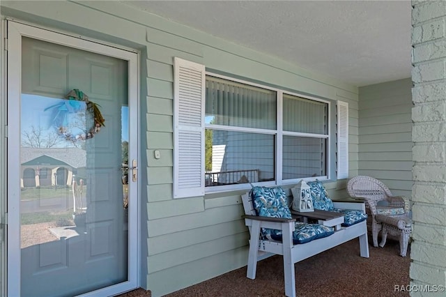 entrance to property featuring covered porch