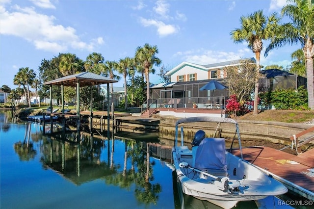 view of dock featuring a lanai and a water view