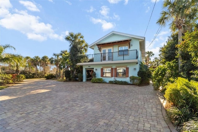 view of front of house featuring a balcony