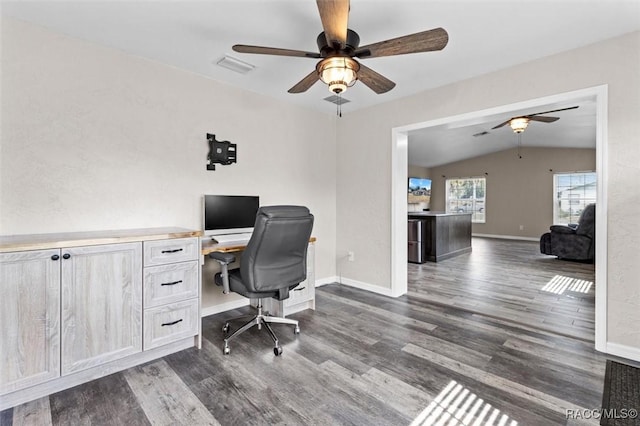 office space with dark hardwood / wood-style flooring, vaulted ceiling, and ceiling fan