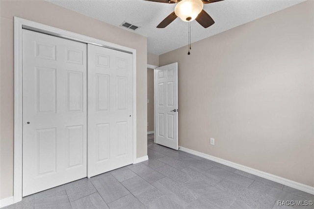 unfurnished bedroom with a closet and ceiling fan