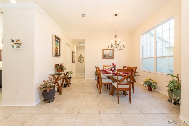 dining space with light tile patterned floors, baseboards, visible vents, and a notable chandelier