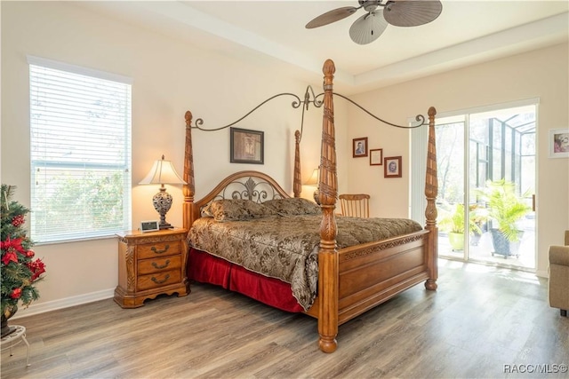 bedroom with ceiling fan, light wood-style flooring, baseboards, and access to outside