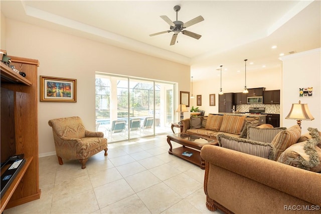 living room featuring light tile patterned floors, a high ceiling, a ceiling fan, and recessed lighting