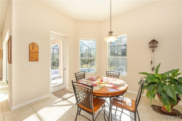 dining area featuring baseboards and light tile patterned floors