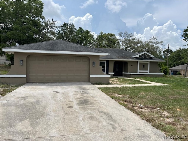 12186 Lamont Dr, Spring Hill, FL 34608 - ranch-style house featuring french doors, a garage, and a front lawn