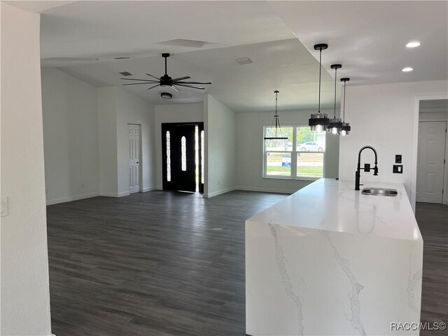 12186 Lamont Dr, Spring Hill, FL 34608 - kitchen featuring pendant lighting, white appliances, sink, light tile patterned flooring, and white cabinetry