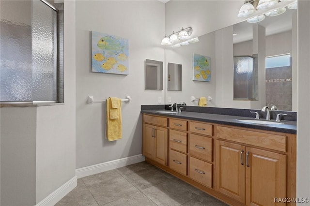 bathroom with vanity, tile patterned flooring, and walk in shower