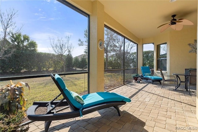 sunroom / solarium with ceiling fan