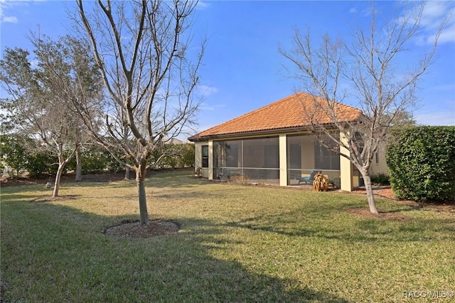 view of yard with a sunroom