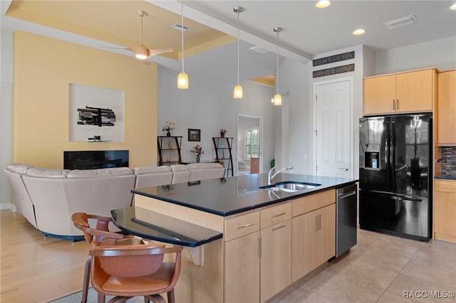 kitchen with sink, decorative light fixtures, light brown cabinetry, black fridge with ice dispenser, and stainless steel dishwasher