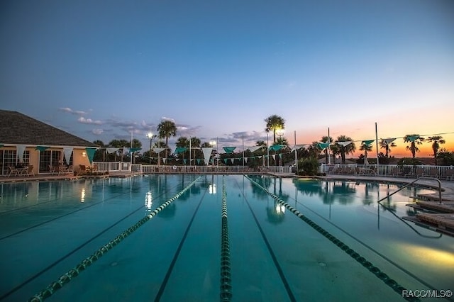 view of pool at dusk