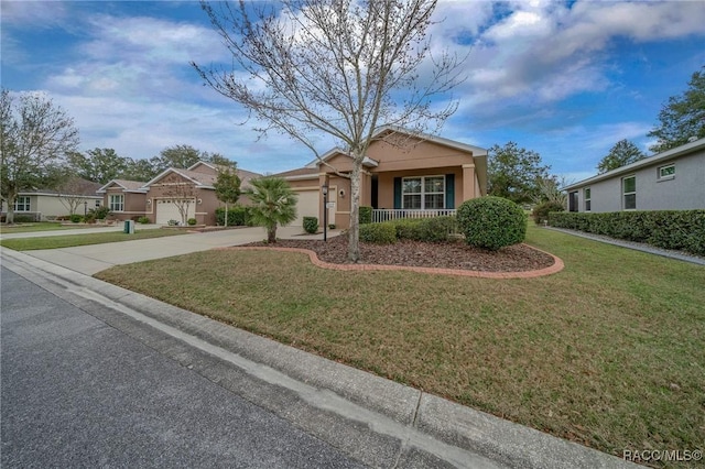 single story home featuring a garage, covered porch, and a front lawn