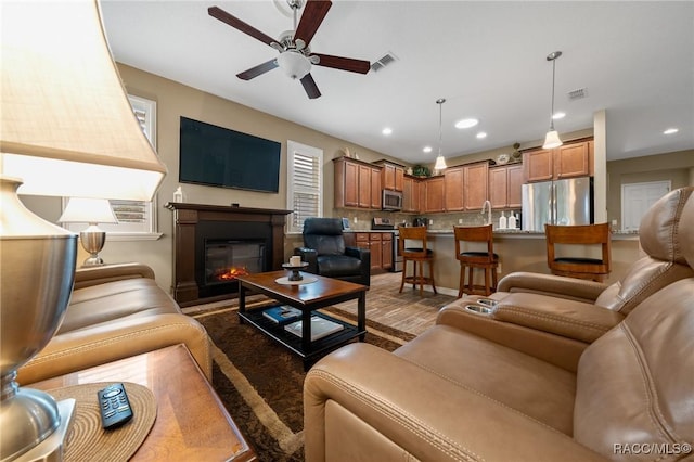 living room with ceiling fan