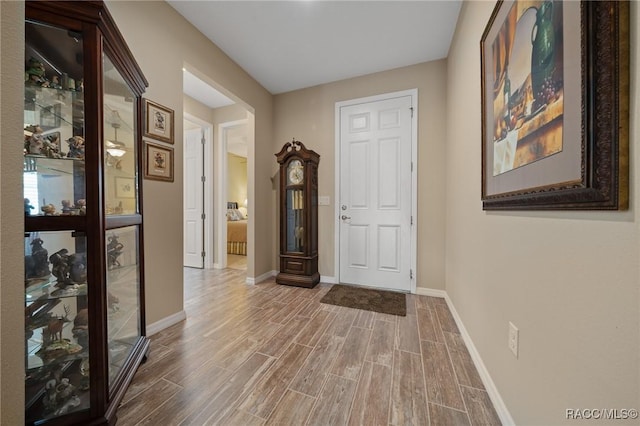 hallway featuring wood-type flooring