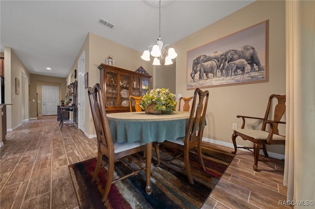 dining area featuring an inviting chandelier