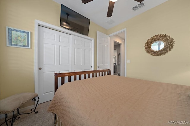 bedroom with carpet, ceiling fan, and a closet