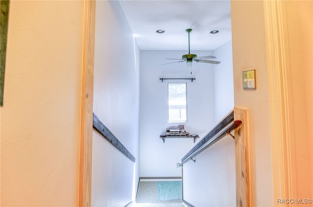 stairs with ceiling fan