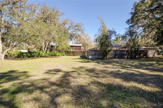 view of yard featuring fence