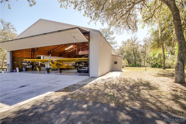 view of property exterior featuring an outbuilding