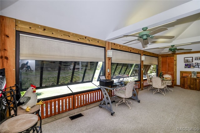 sunroom / solarium with beamed ceiling, visible vents, and a ceiling fan