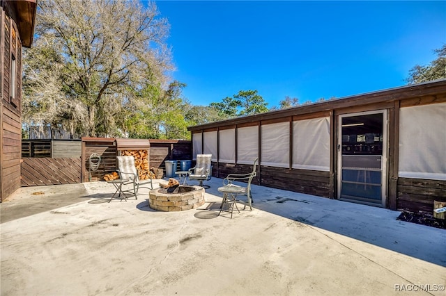 view of patio / terrace featuring a fire pit