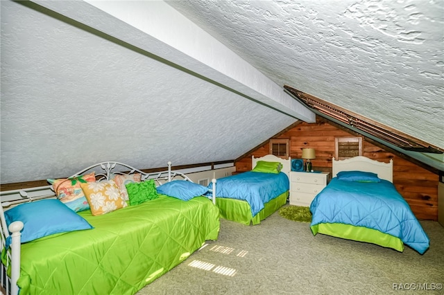 bedroom featuring lofted ceiling with beams, wood walls, a textured ceiling, and carpet flooring