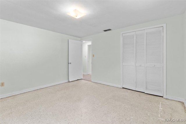 unfurnished bedroom featuring a closet