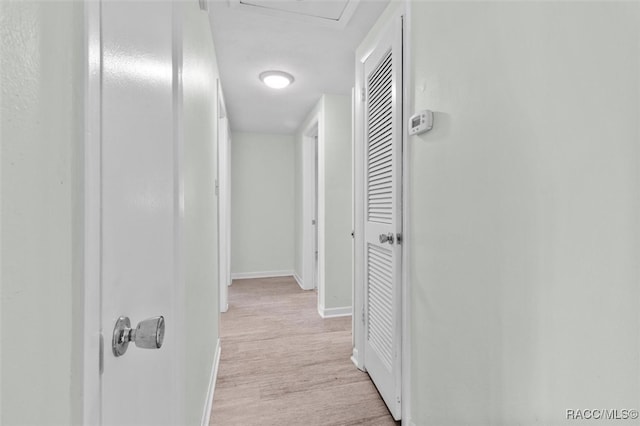 hall with light hardwood / wood-style floors