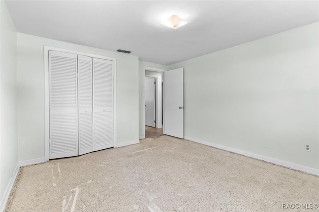 unfurnished bedroom with a closet