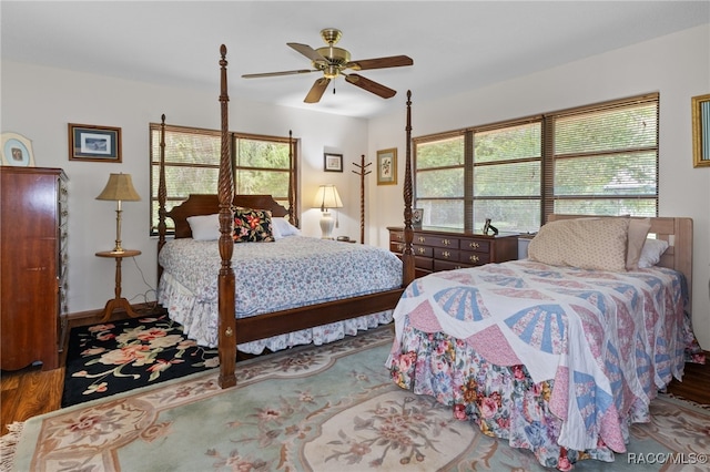 bedroom featuring hardwood / wood-style floors and ceiling fan