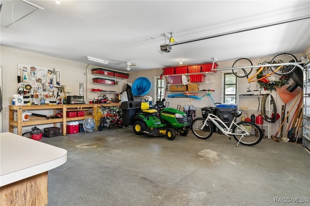 garage featuring a workshop area and a garage door opener