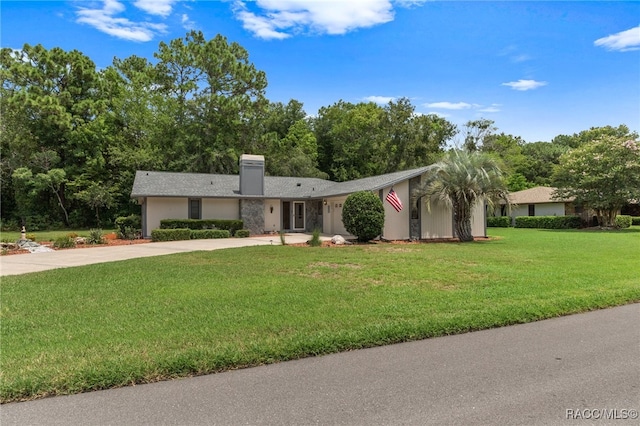 ranch-style house with a front lawn