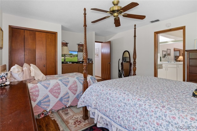 bedroom featuring hardwood / wood-style flooring, ceiling fan, and ensuite bathroom