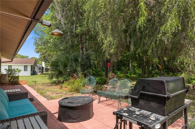 view of patio featuring a grill