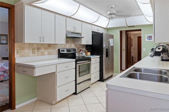 kitchen featuring appliances with stainless steel finishes, ceiling fan, sink, light tile patterned floors, and white cabinetry