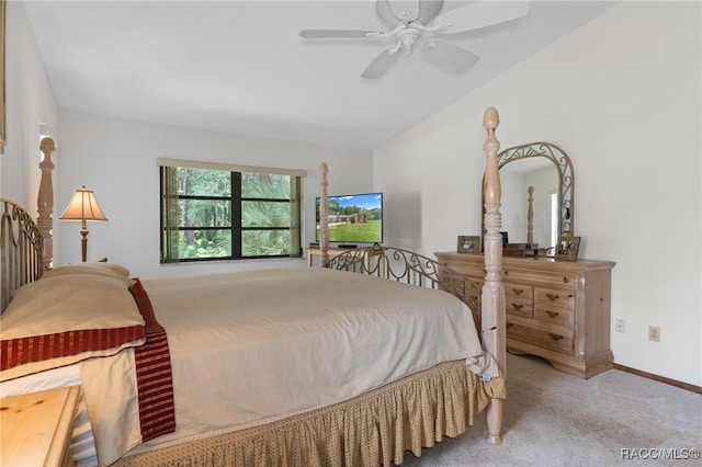 bedroom with ceiling fan, carpet floors, and lofted ceiling