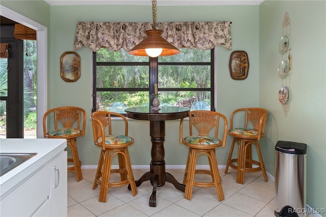 dining space with light tile patterned floors