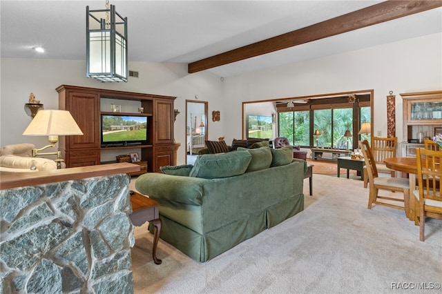 carpeted living room with vaulted ceiling with beams